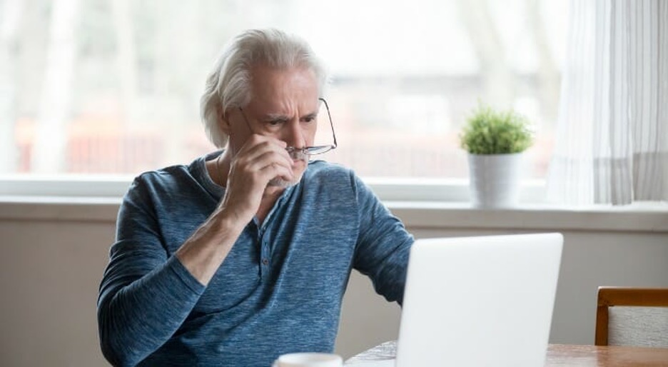 man looking at laptop